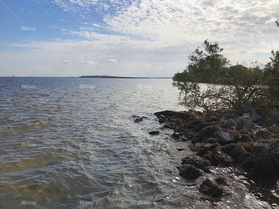 Water lapping at a rocky shore.