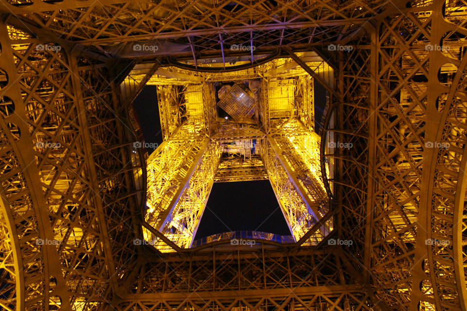 Looking up from under the Eiffel tower,Paris