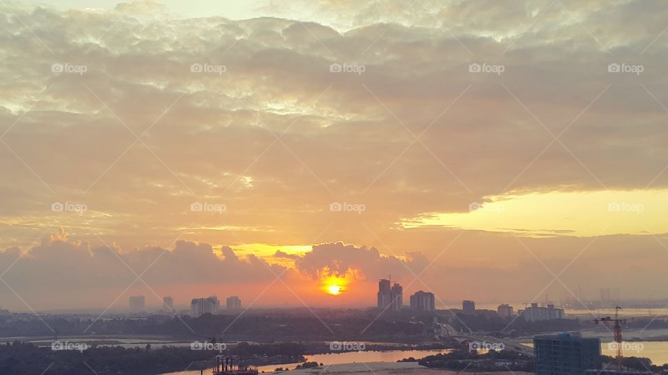 Sunrise view against cloudy sky