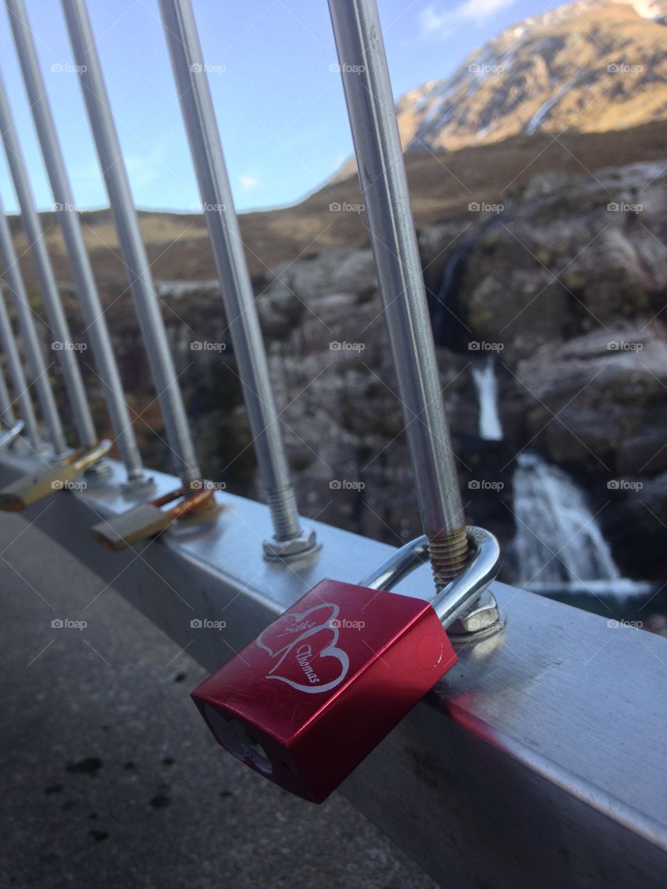 Lovers lock in their love and throw away the key in a tasteful pool of Scottish water 