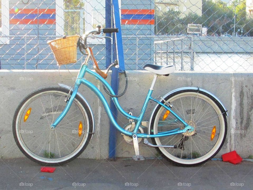 Bike on the waterfront. Blue bike on the waterfront in the city