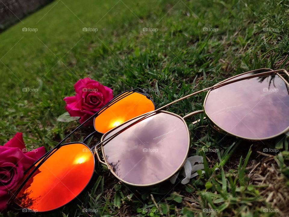Sunglasses with sky reflection,