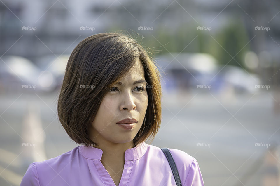 Portrait of Asean Women with short hair brown.