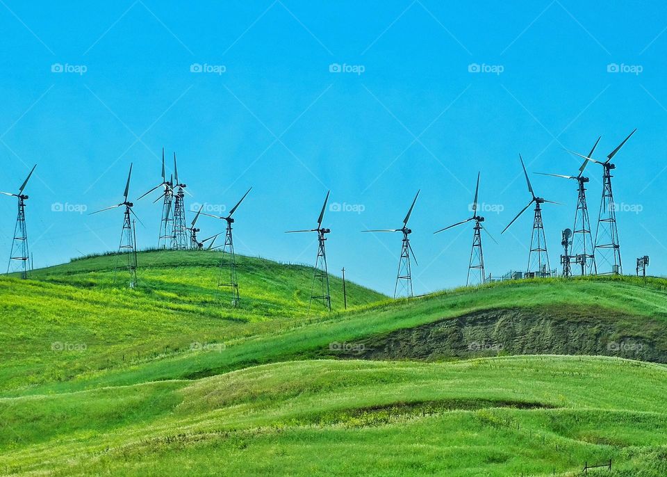 Wind Power Farm. Green Hills Covered With Wind Power Turbines Generating Clean Renewable Energy
