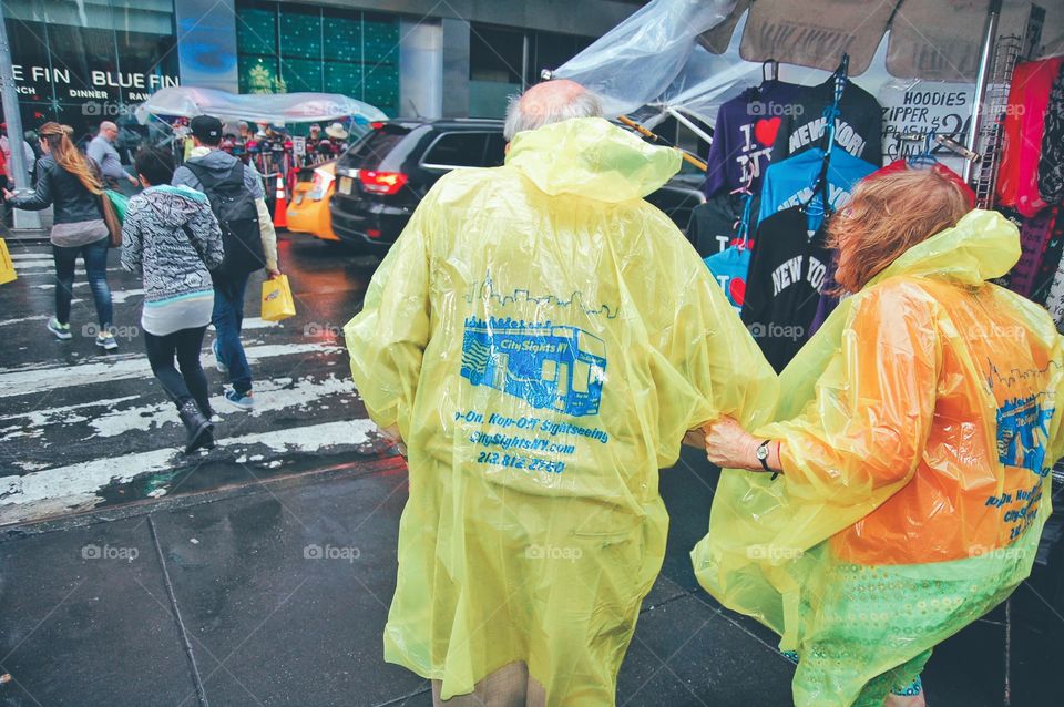 Elderly tourists caught in the rain in NYC