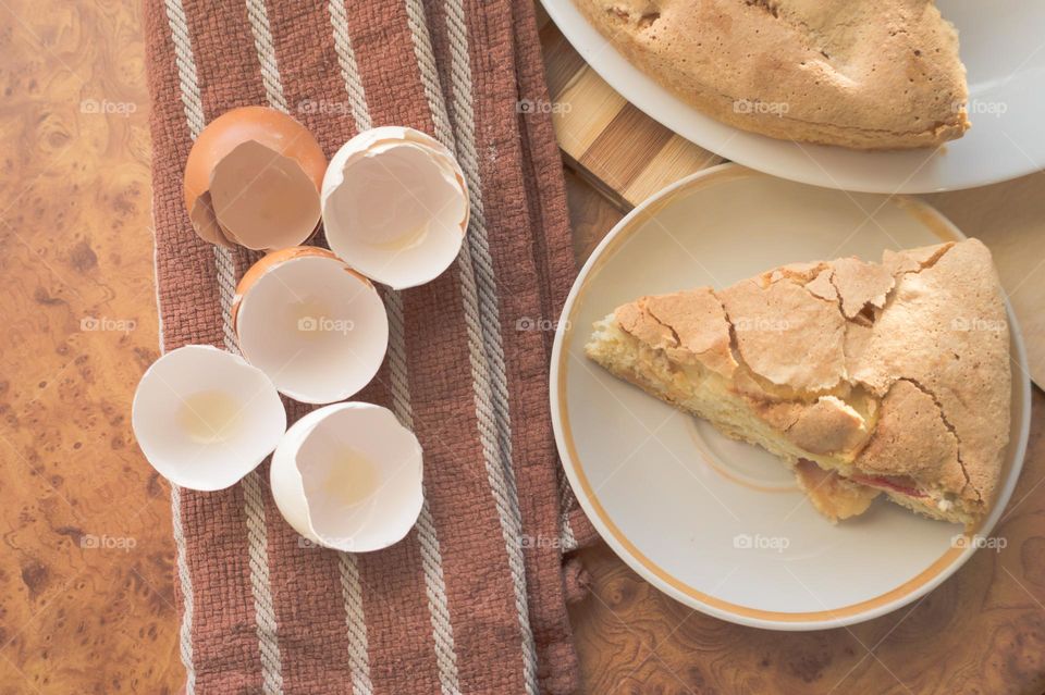Making homemade puffed apple pie with eggs, sugar and flour.
