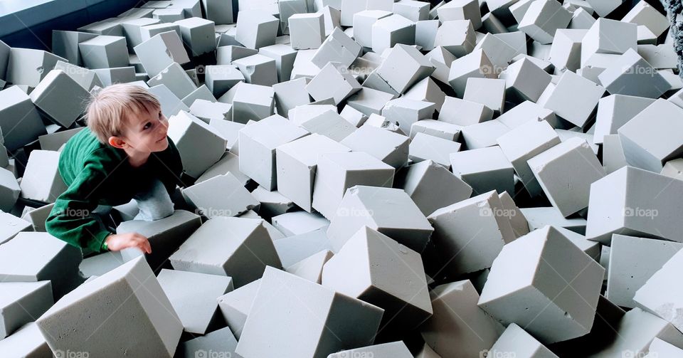 boy in foam rubber cubes