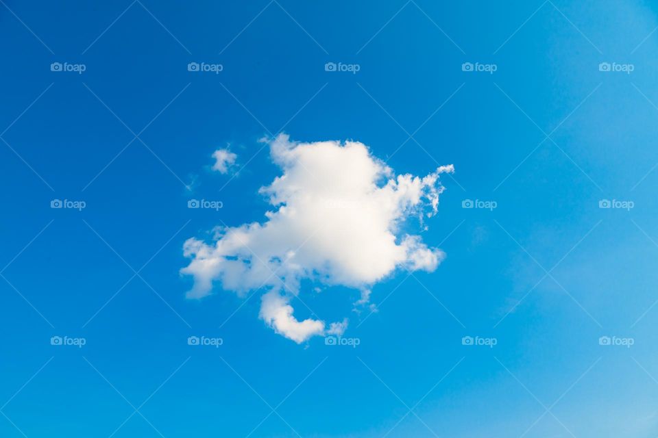 Clouds: Lonely white cloud on blue sky