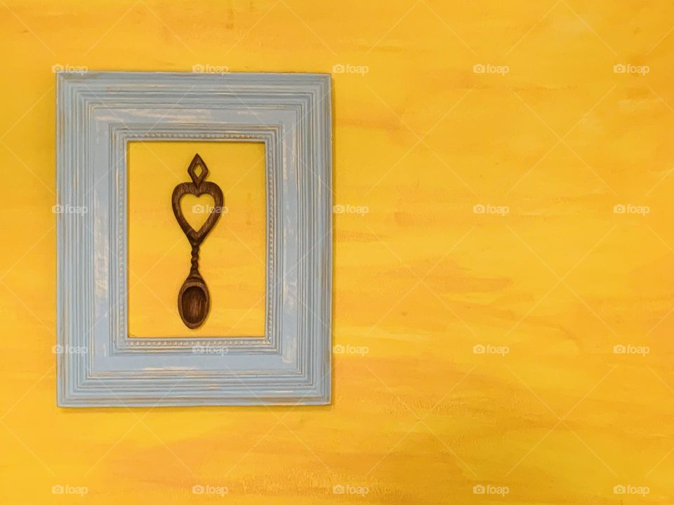 Yellow wall with Wales love spoon