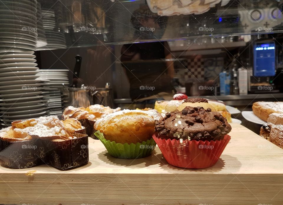Muffins and sweet pastries in a coffee-bakery