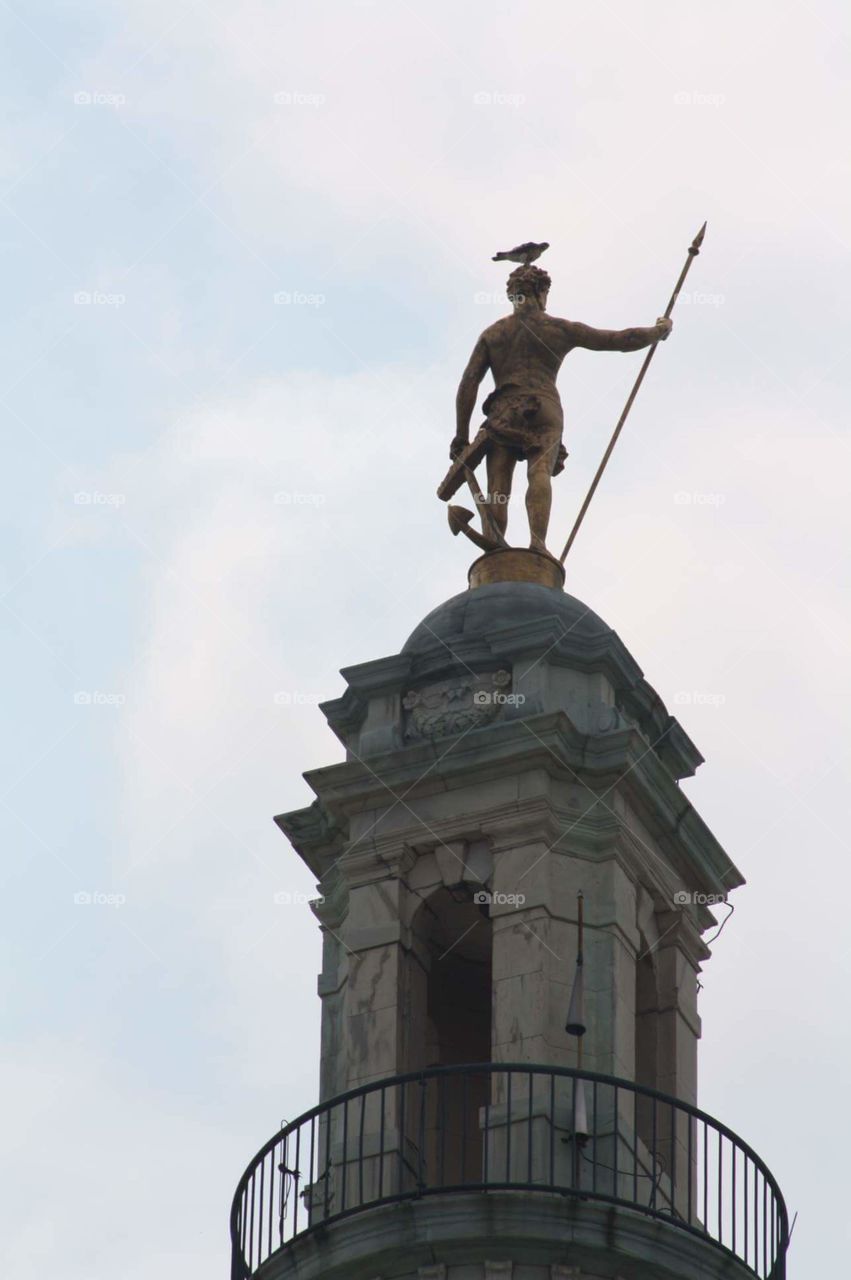 Bird on top of Statue on done of Rhode Island State Capital