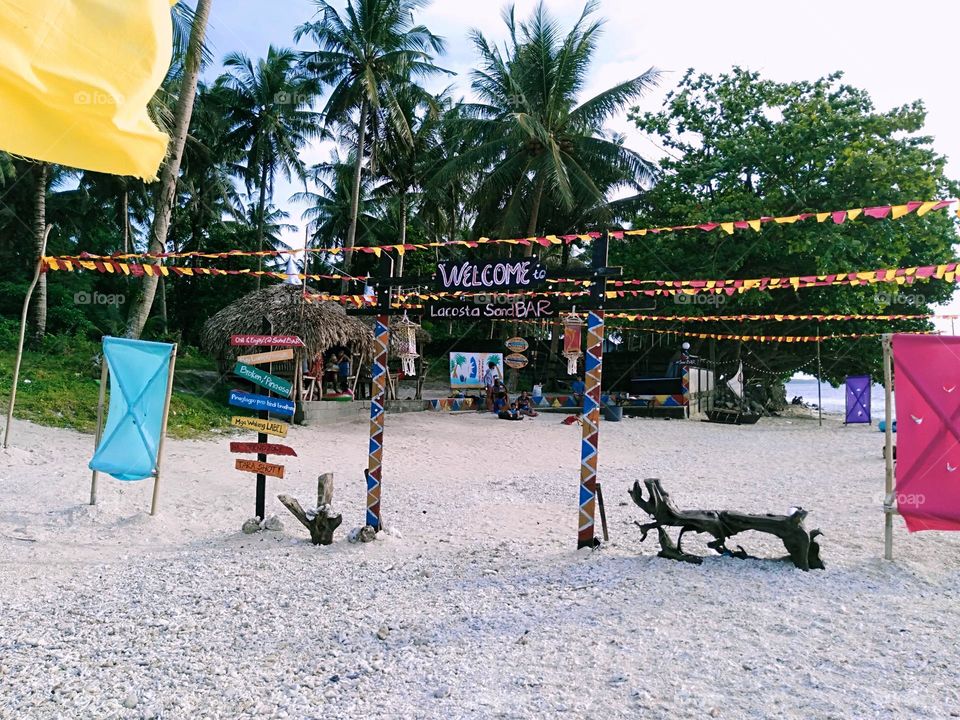 The natural beauty of a resto bar and beach resort with its wooden arts and design.