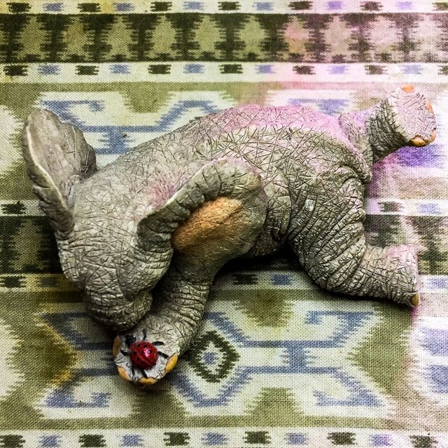 A 69¢ figure of an elephant with hanging out with his friend ladybug.