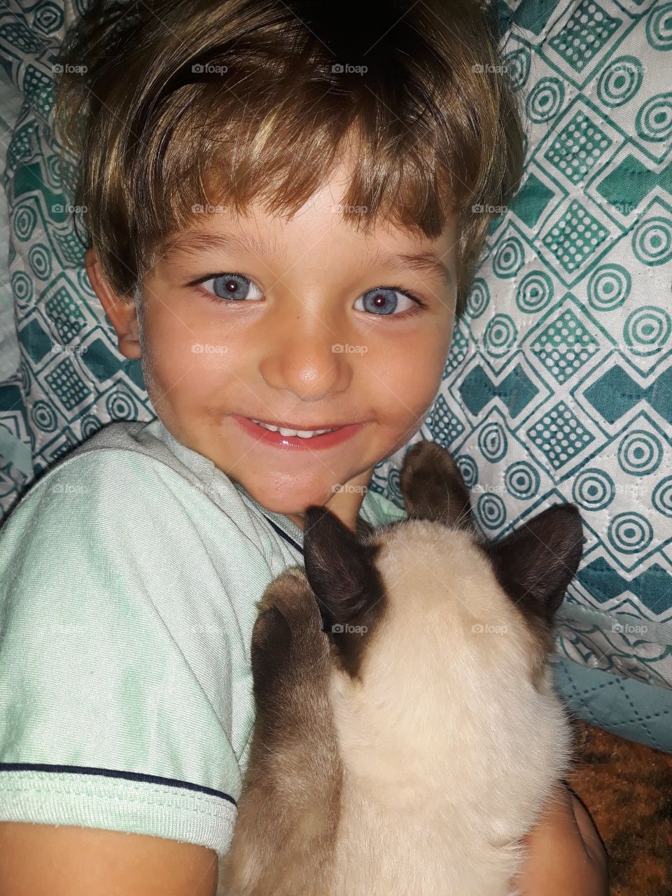 cute child smiling with cat