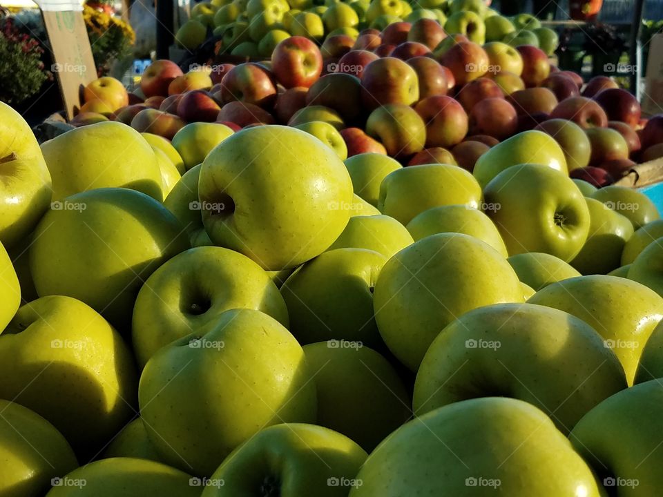 A group of green and red apples.