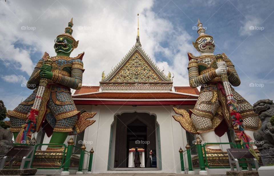 The famous Giant statue of Wat Chaeng (Wat Arun) in Bangkok Thailand is the favorite art for tourists    