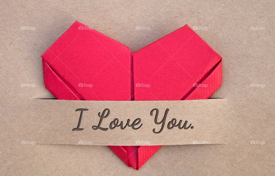 I love you banner and red paper heart