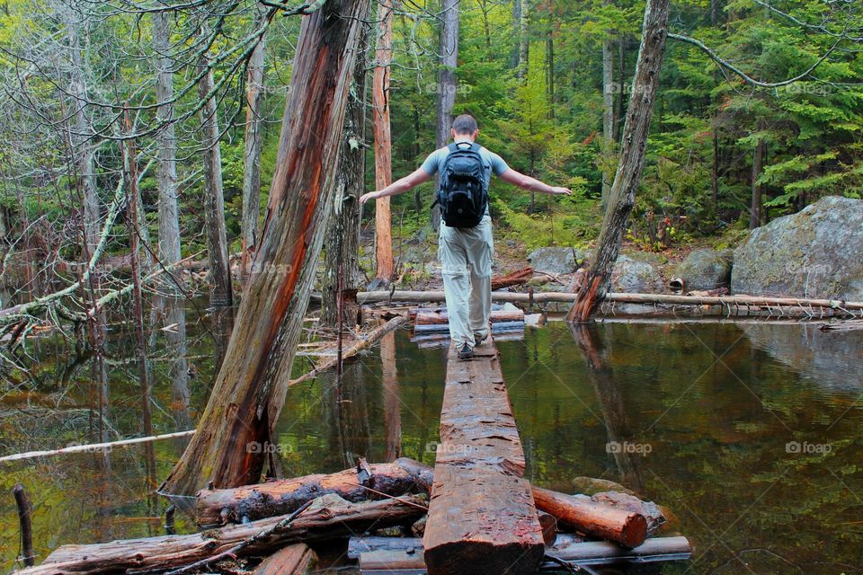 Hiker crossing water