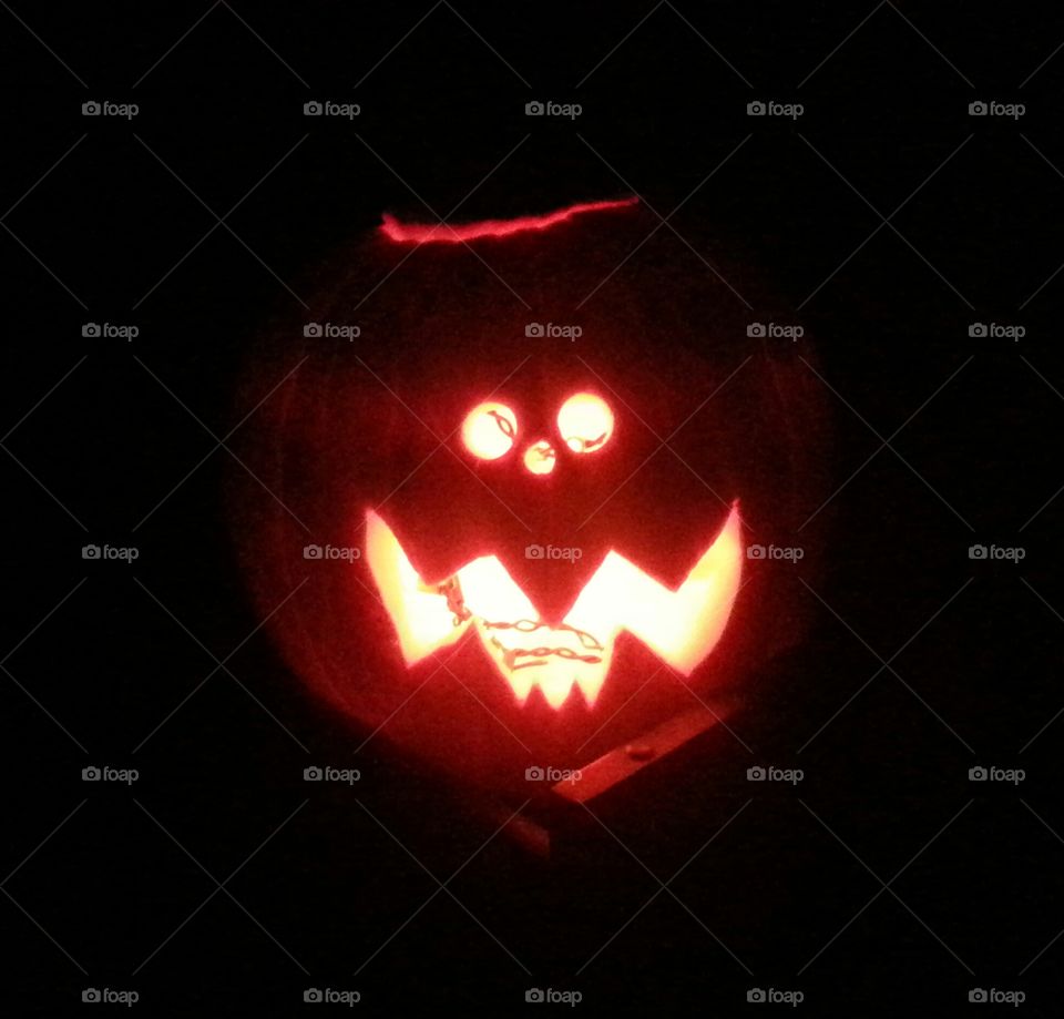 Happy Halloween pupkin carved and glowing