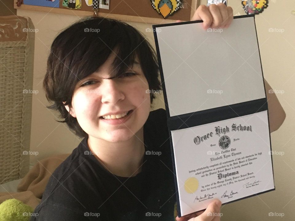 Graduate with diploma 