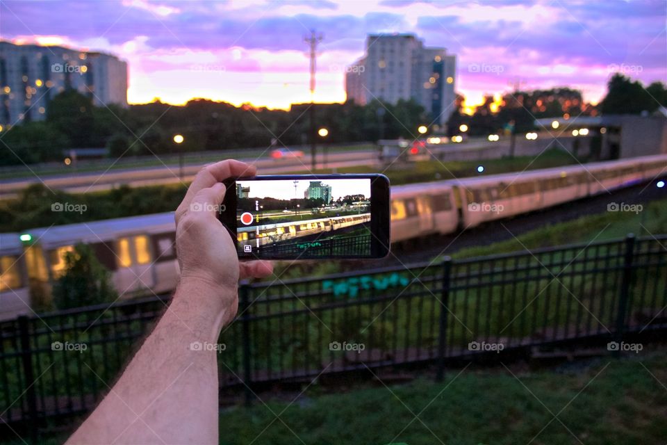 Using my mobile device to take a photograph of the subway arriving at Grosvenor Strathmore Metro Station in North Bethesda Maryland.