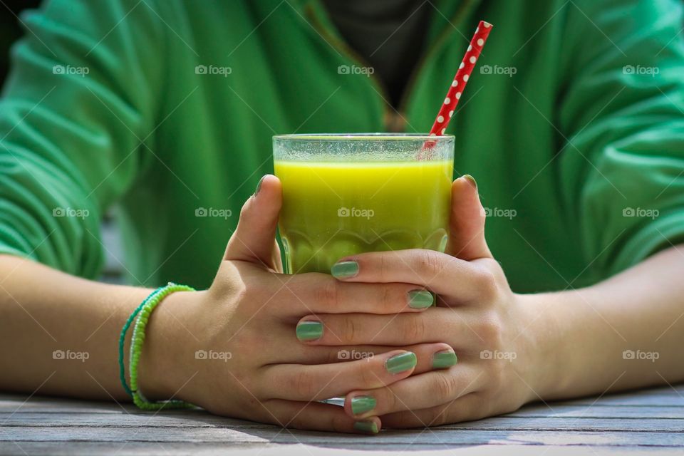 Woman hand holding juice