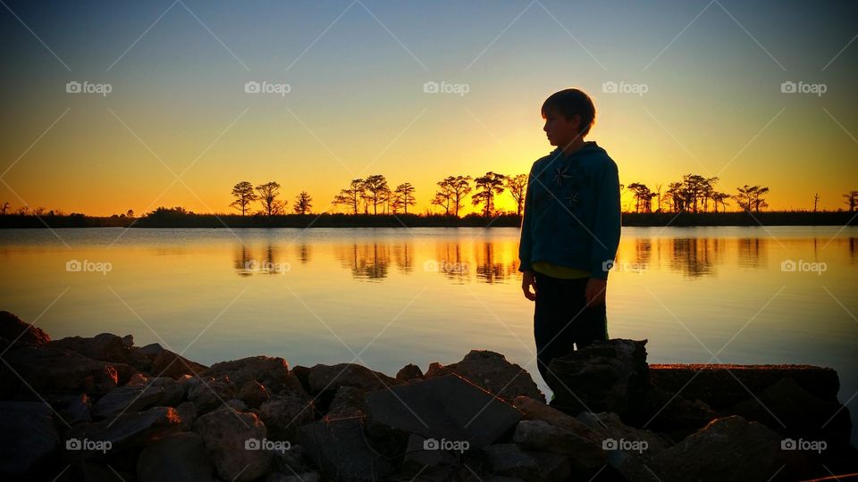 silhouette sunset water river rocks outdoors nature reflection