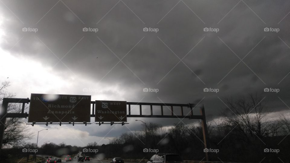 Stormy sky, highway sign