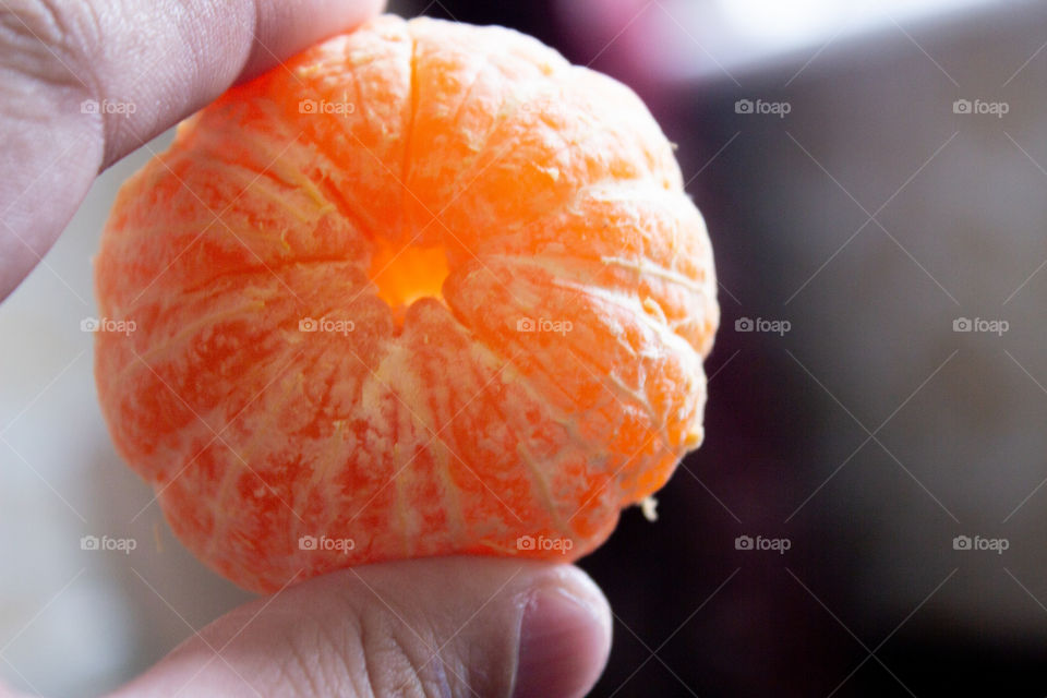 Mandarin in hand