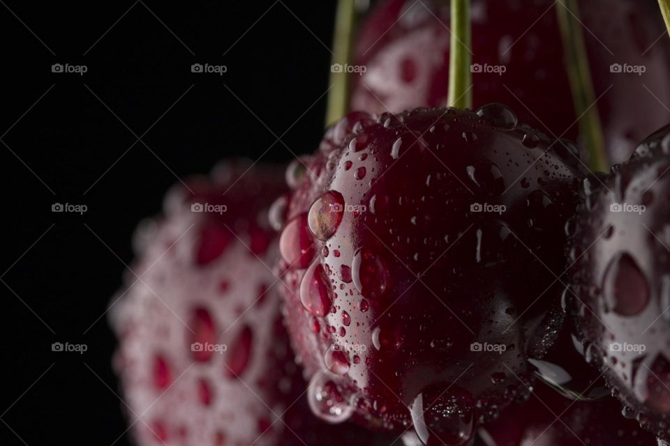 macro shot of cherry with water drops