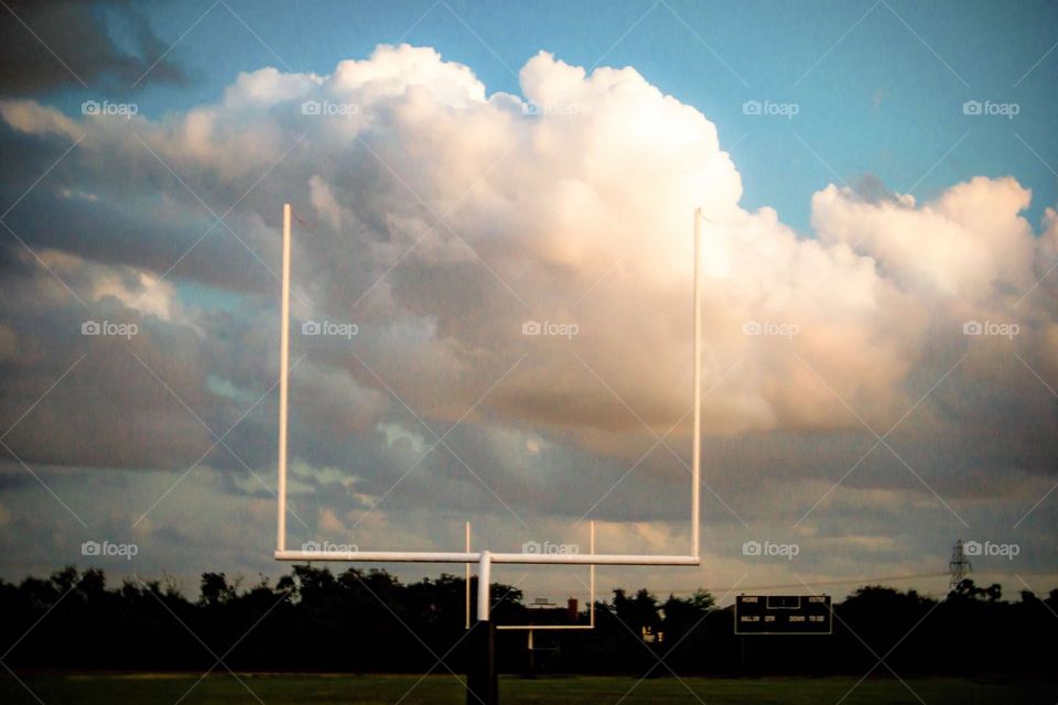 Clouds over the football field. It looks like smoke from air pollution kind of! 