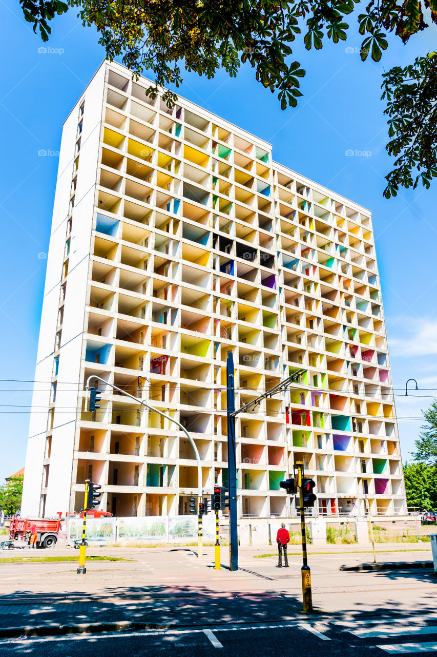 building for demolition, color in apartments is still going on