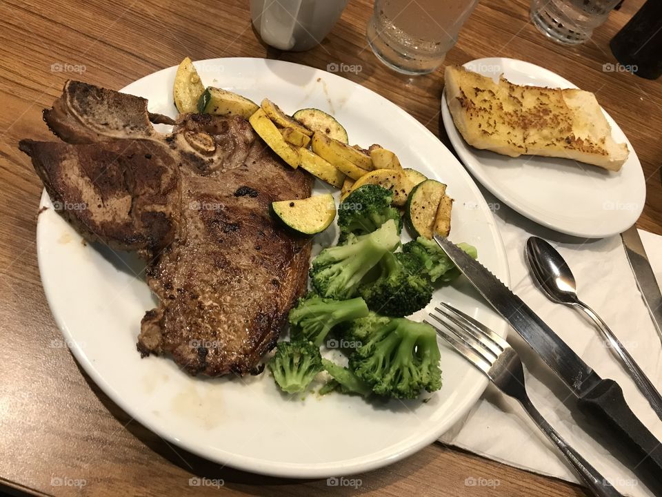 T-bone steak dinner. This meal looks and tastes mighty good. So good that it was quite fulfilling.