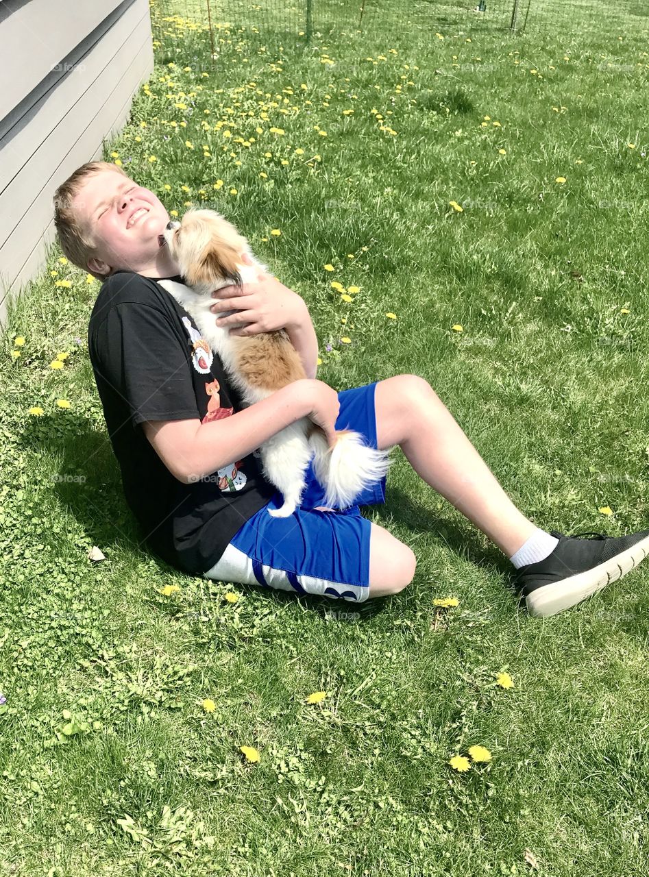 Darling photo of how to stay healthy mentally...playing with a puppy who adores you!! 