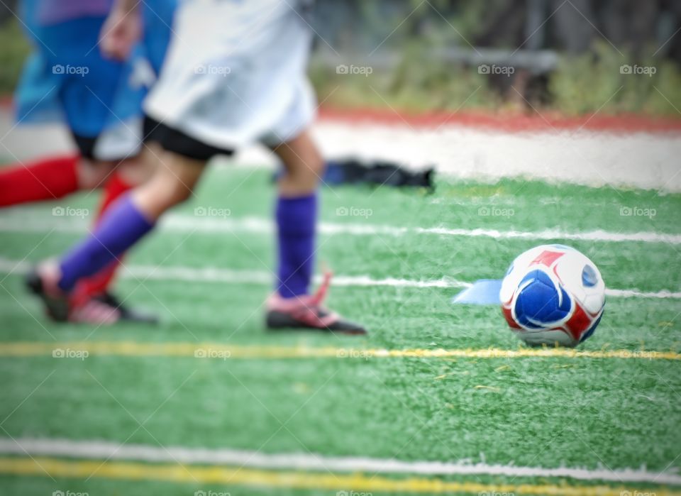 Youth Soccer. Kids Chasing A Soccer Ball
