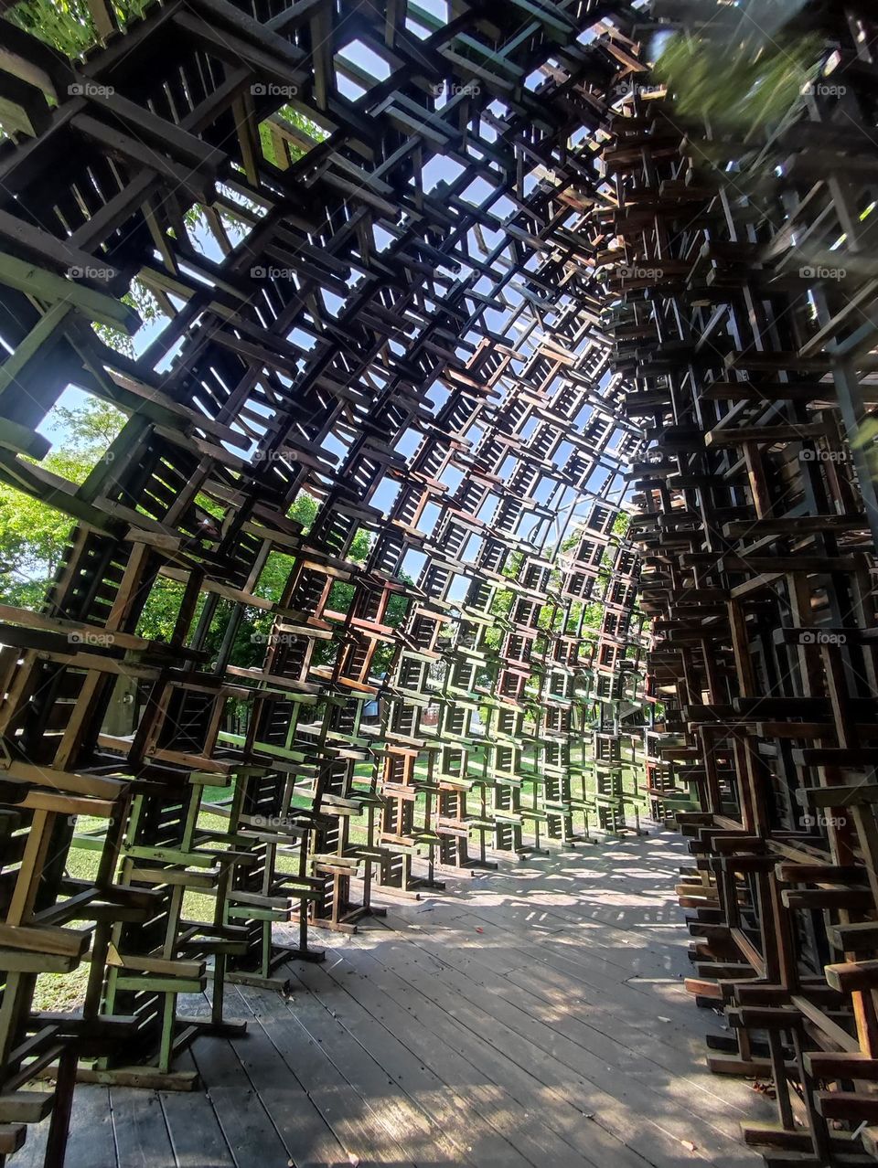 Dome built with  school used wooden chairs, installation decoration
