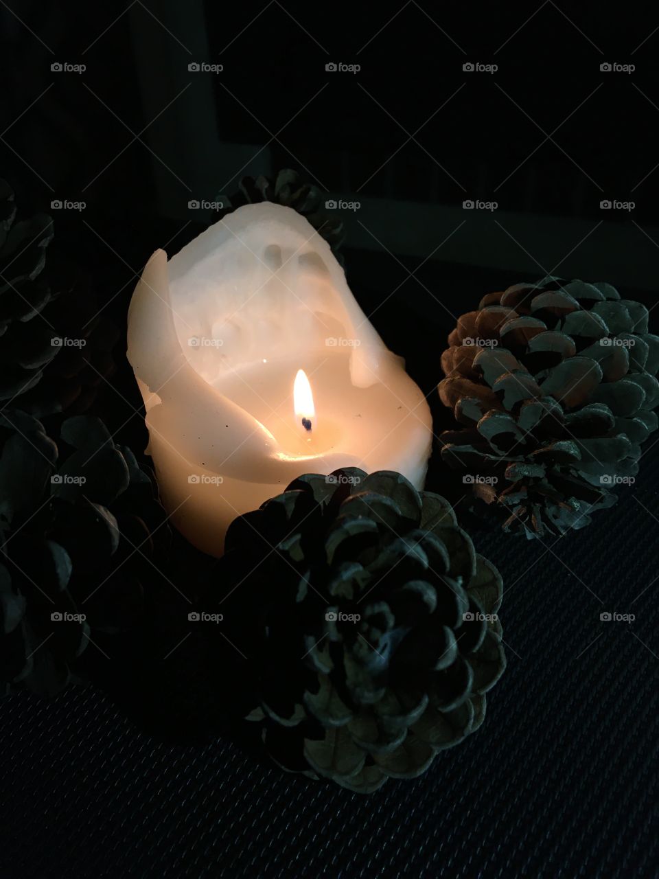 Pine cones with sweet candle light