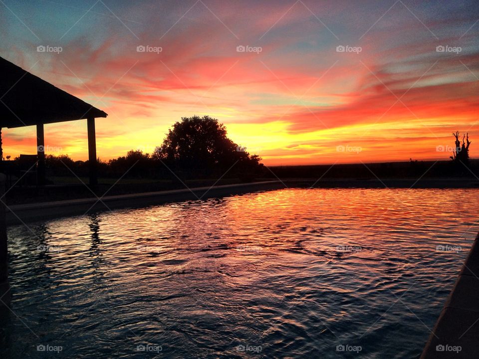 Sunset over a pool in France