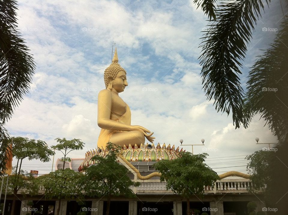 The big gold Buddha image at temple in Thailand.