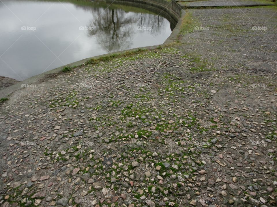 reflections and stones lake shore