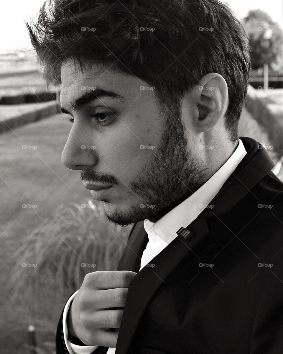 Monochrome suit portrait side view 