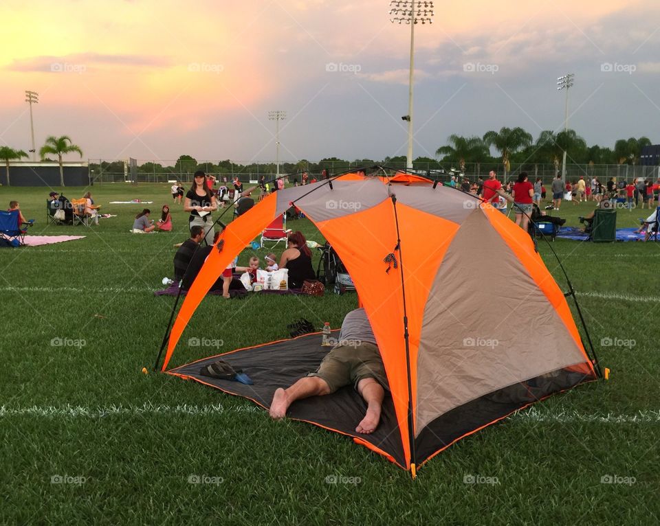 Orange tent at a festival.