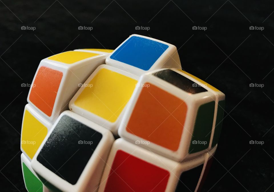 Colourful Rubik’s Cube against a black background