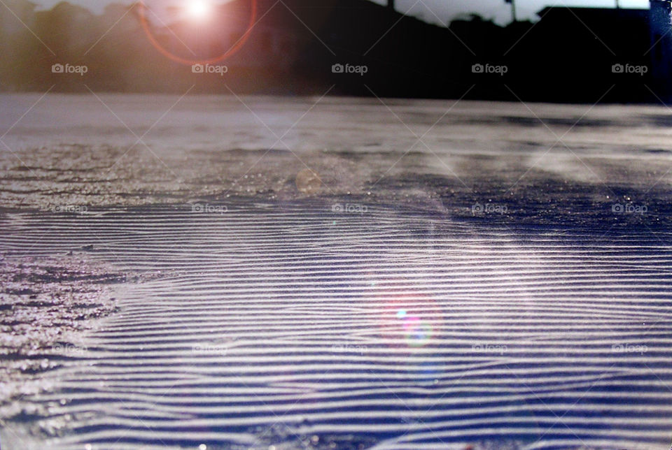 wind blowing creating sand waves on the beach . Florida beach 