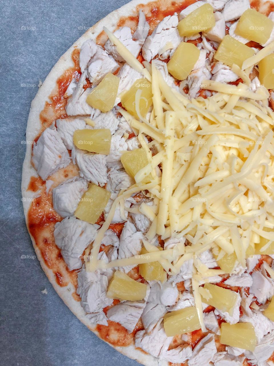 Cooking pizza with pineapple