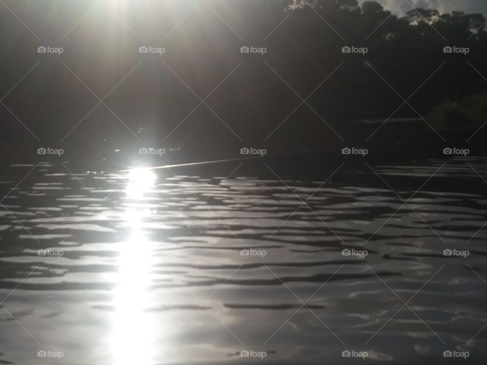 this is another great shot of the sun reflecting off the water at dusk from the boat dock in Texas