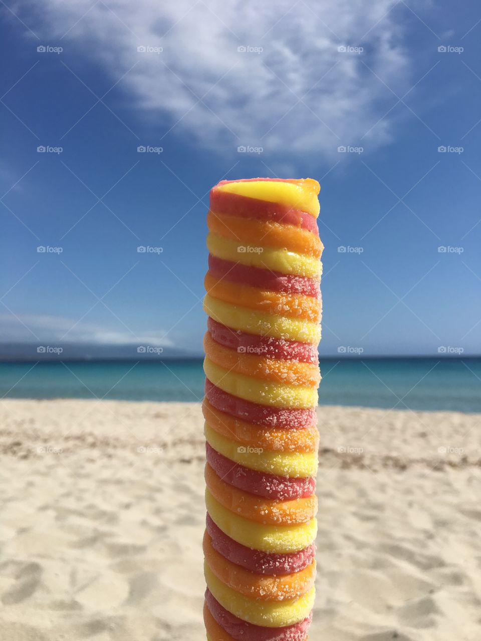 Close-up of multi colored candy at beach