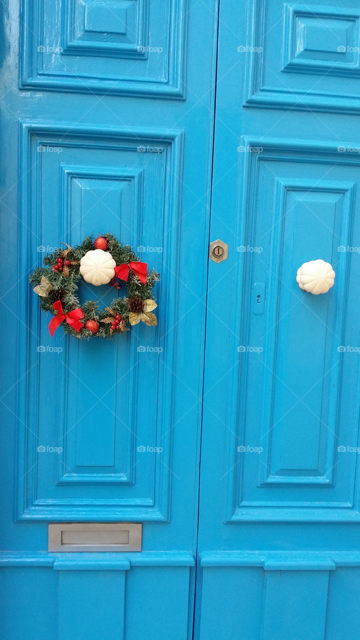 Blue door with Christmas wreath