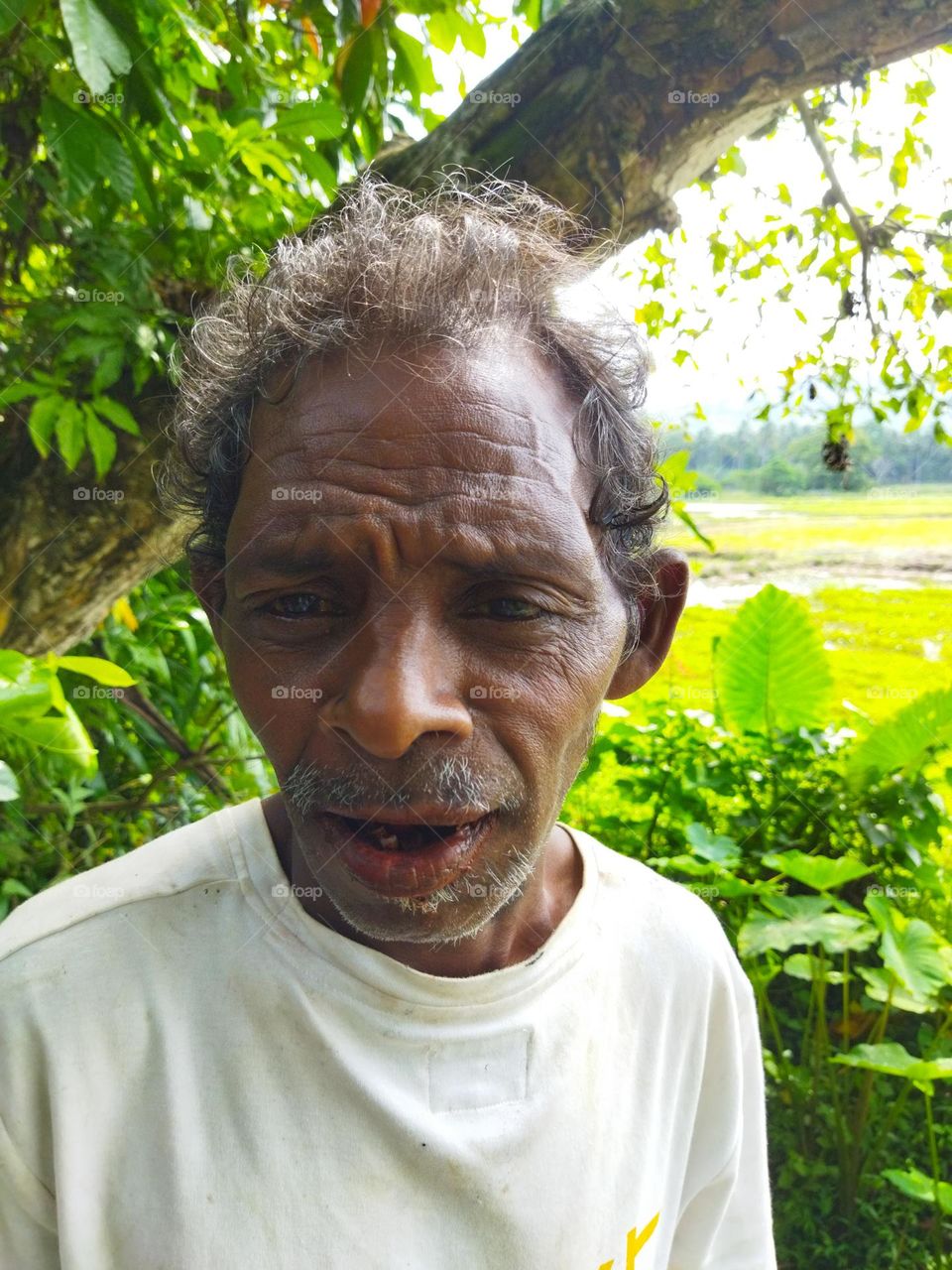 Innocent happy man I've ever seen in my life. He was curious here about my phone and was very happy about taking his photo. His village was behind him.❤