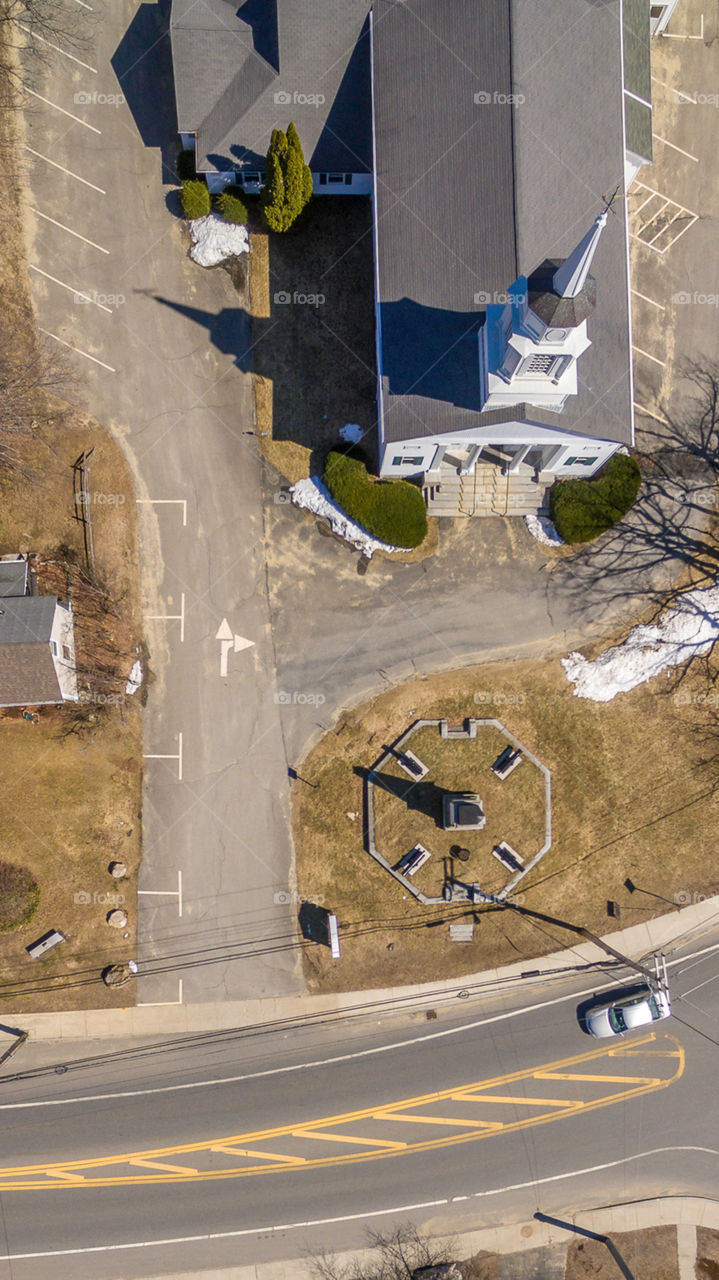 Birdseye white church with a steeple